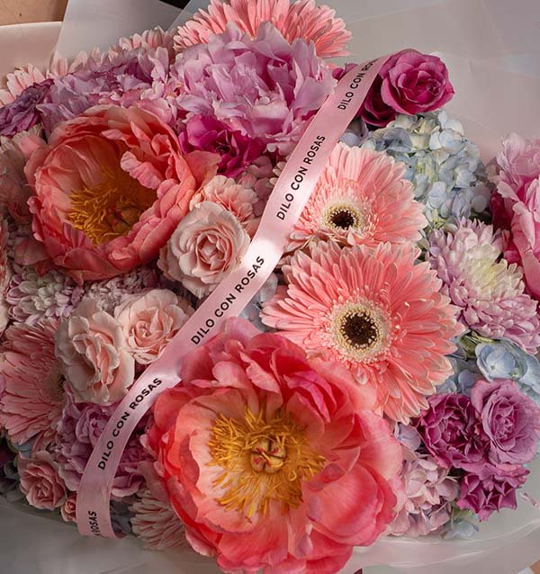 Vibrant mixed flower bouquet with pink peonies and gerberas Rosesland USA